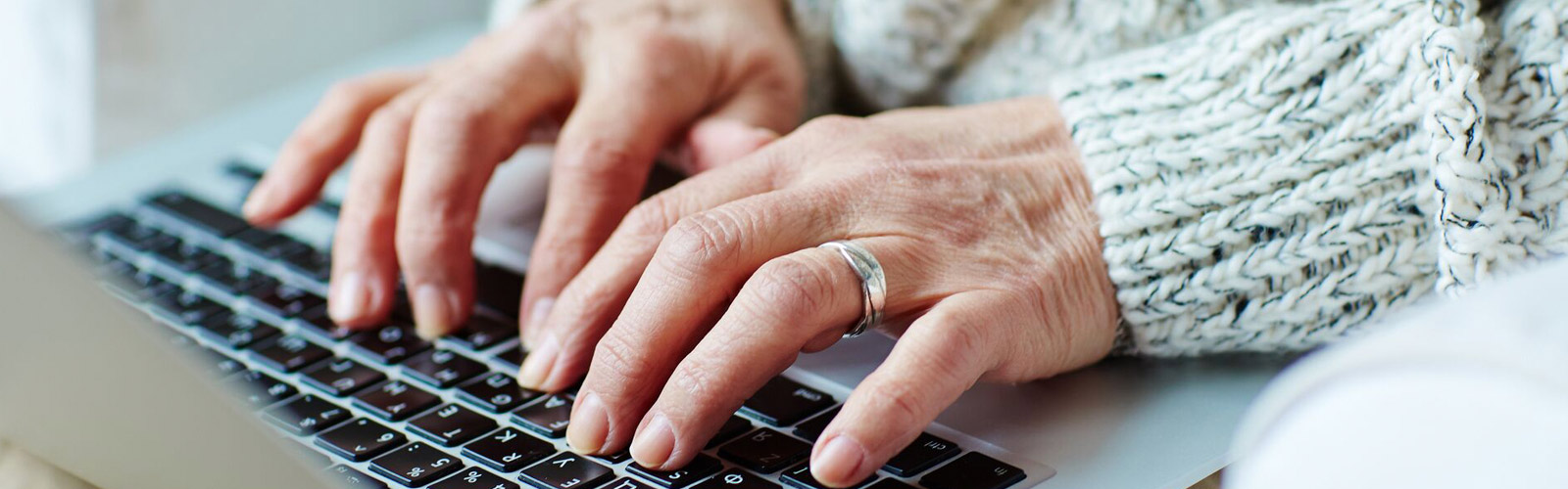 Image of hands typing on a keyboard.